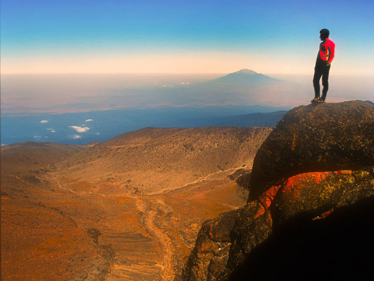 Mountain climber enjoys view from atop Mt Kilimanjaro